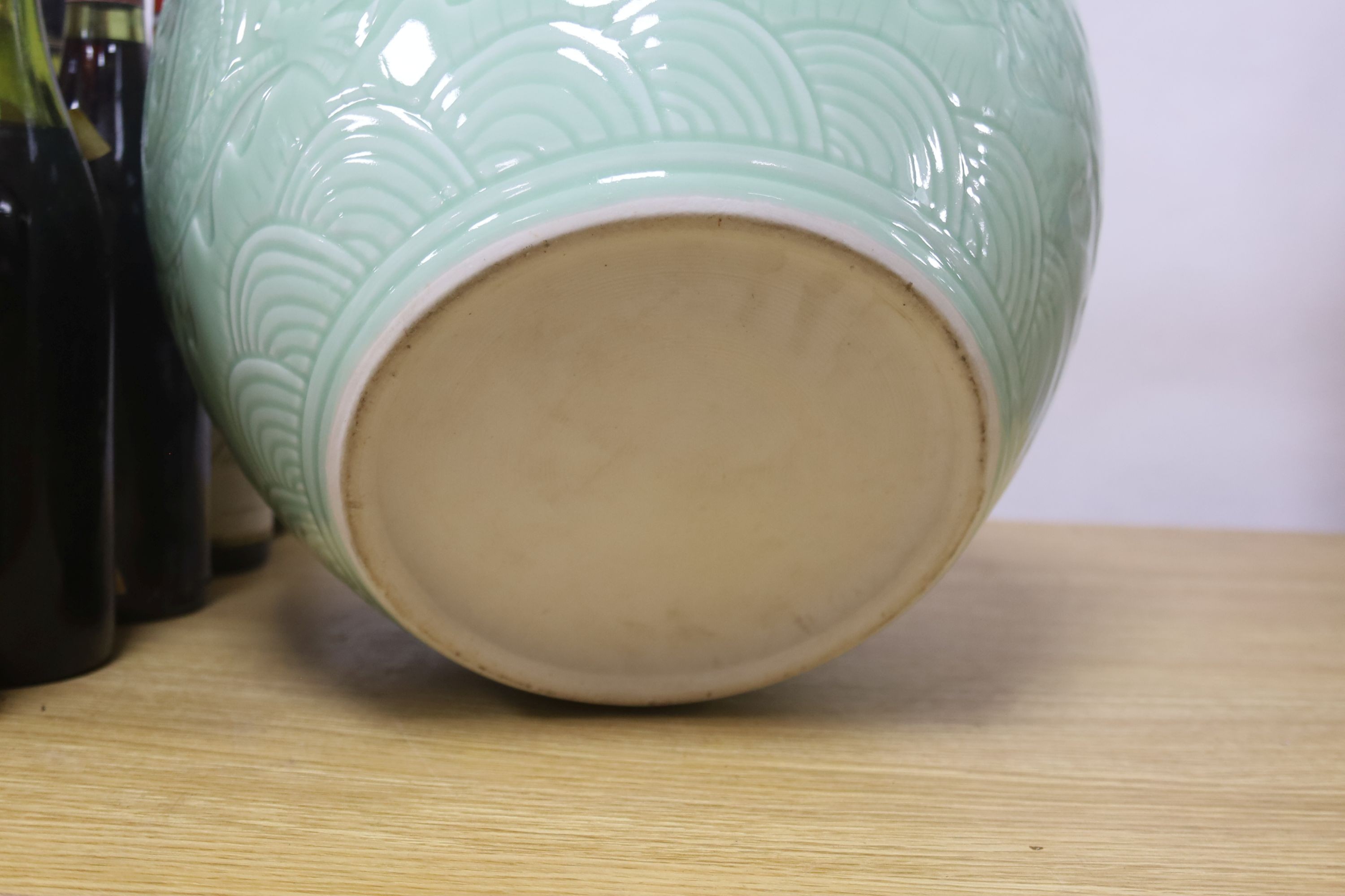 A large Chinese celadon glazed 'dragon' jardiniere or fish bowl 29cm